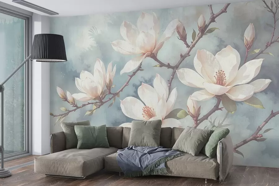Fototapet Vita magnoliablommor som blommar på trädgrenar mot en mjuk, suddig texturerad blå bakgrund w08383