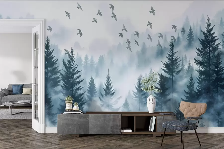 Fototapet Lugn dimmig skog med träd i blå nyanser och en flock fåglar som flyger i skyn  w08664