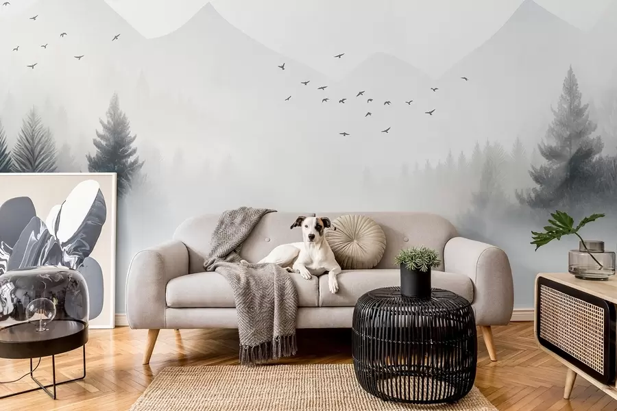 Fototapet Fridfull vinterskog på en bergssluttning i nyanser av vitt och ljusgrått w08756