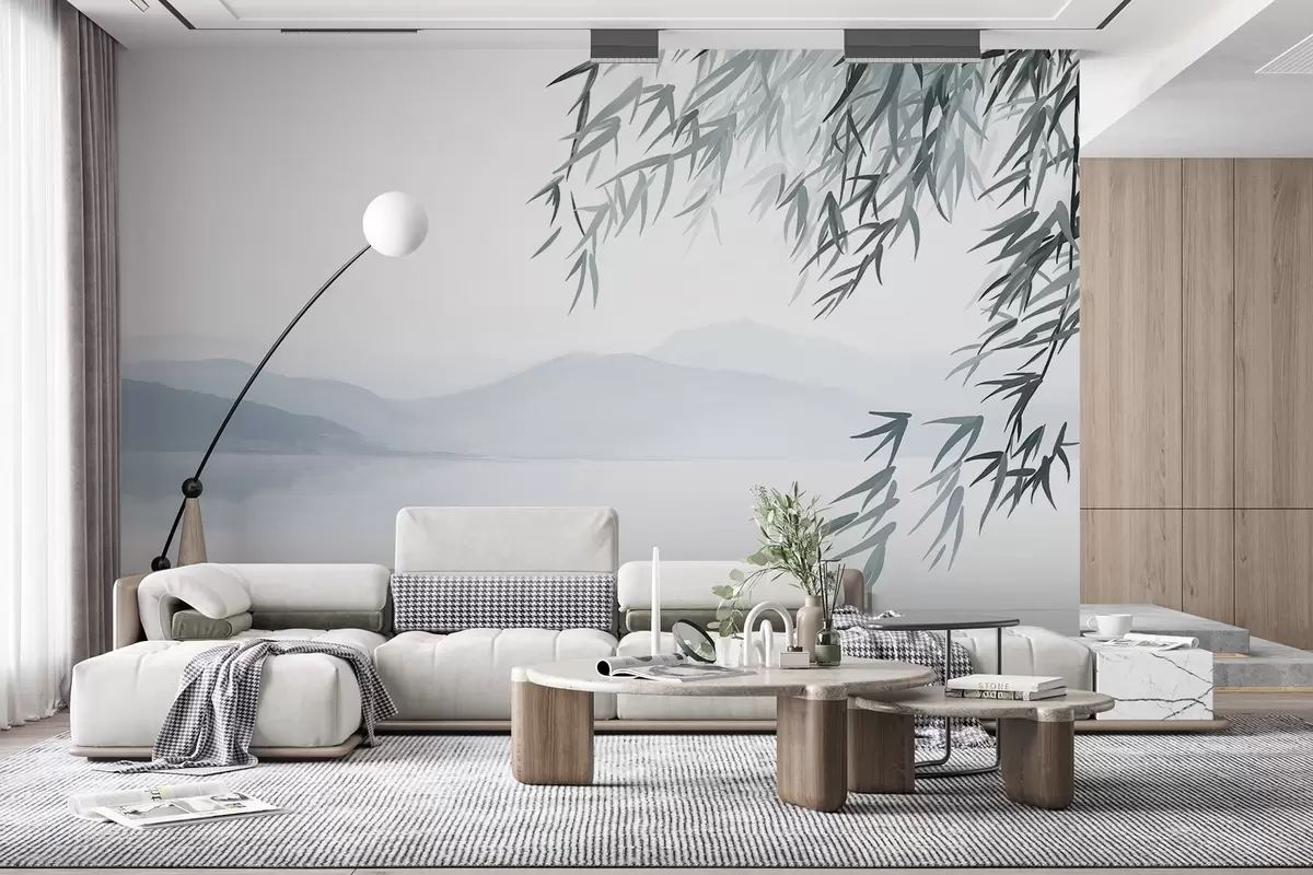 Fototapet Bambulöv hängande över en sjö med berg i bakgrunden, mjuka blå och vita toner, tuschmålningsstil w09048