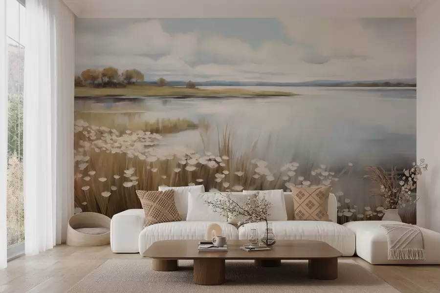 Fototapet Strukturerat landskap, fält med vita blommor och högt gräs, en sjö i bakgrunden, en gräsbevuxen kulle med träd, mjuka färger w09530